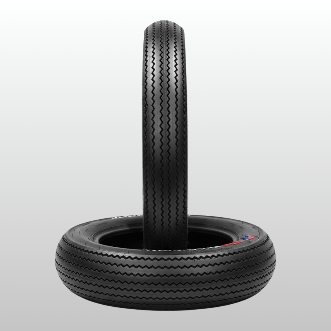 Two black tires stacked on a light gray background