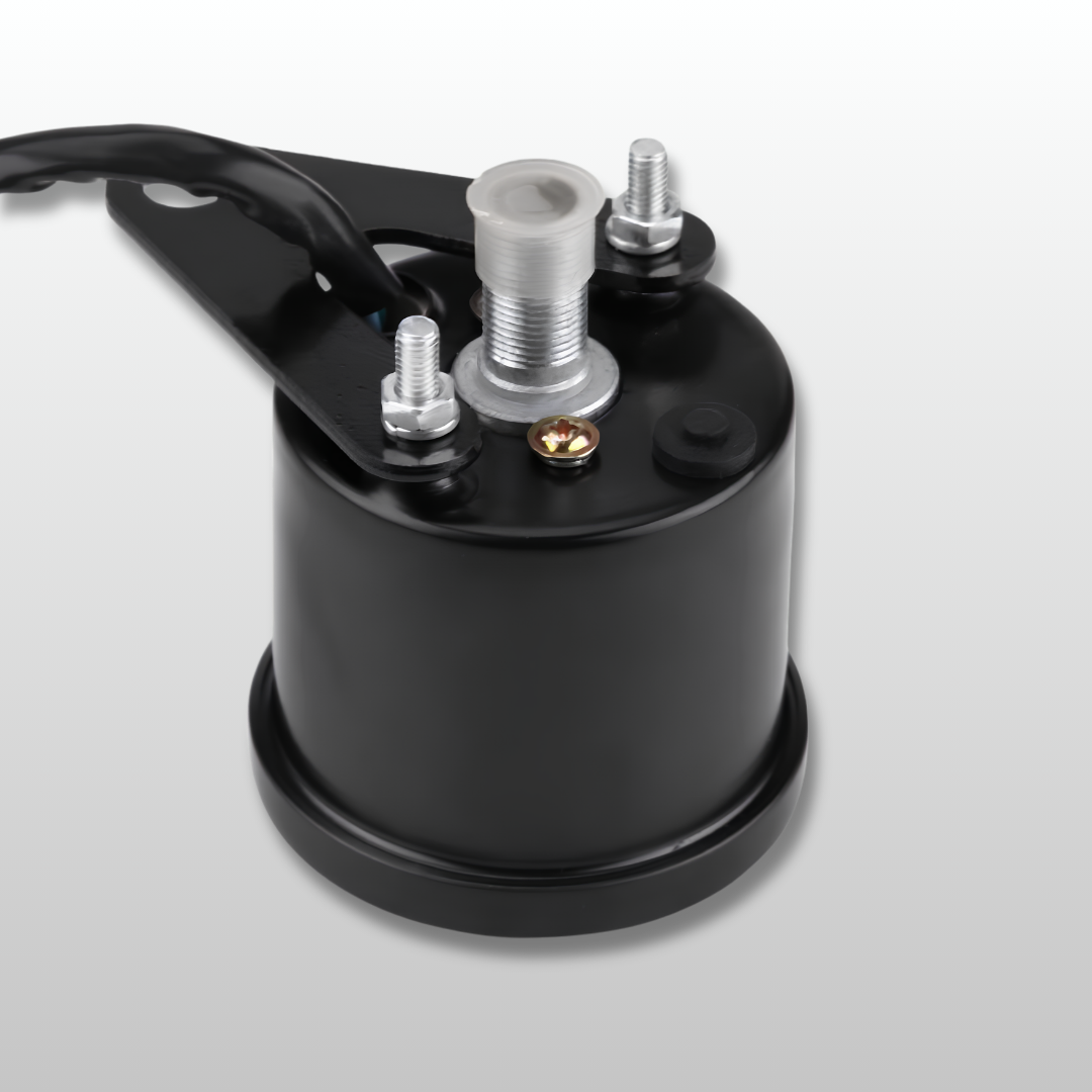 Black cylindrical component with metal bolts and wiring on a light gray background